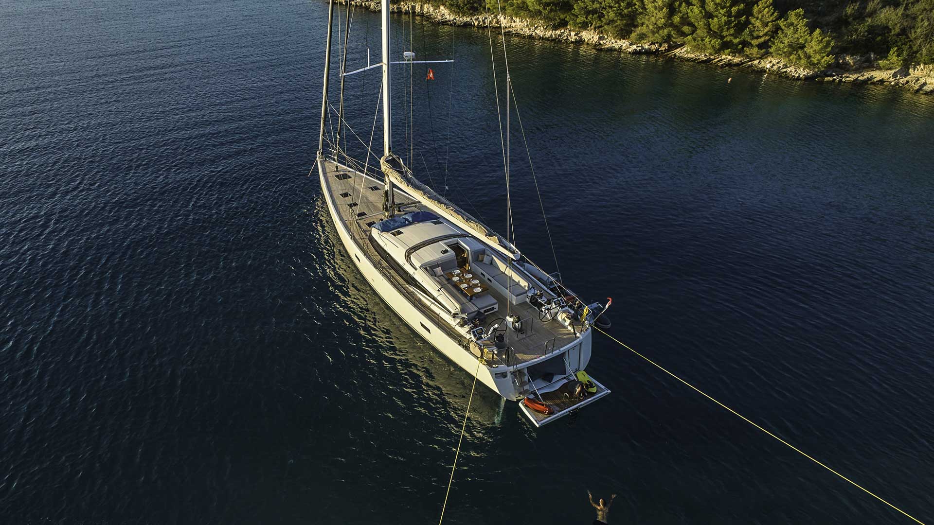 CNB 76 Aenea at anchor in a scenic bay