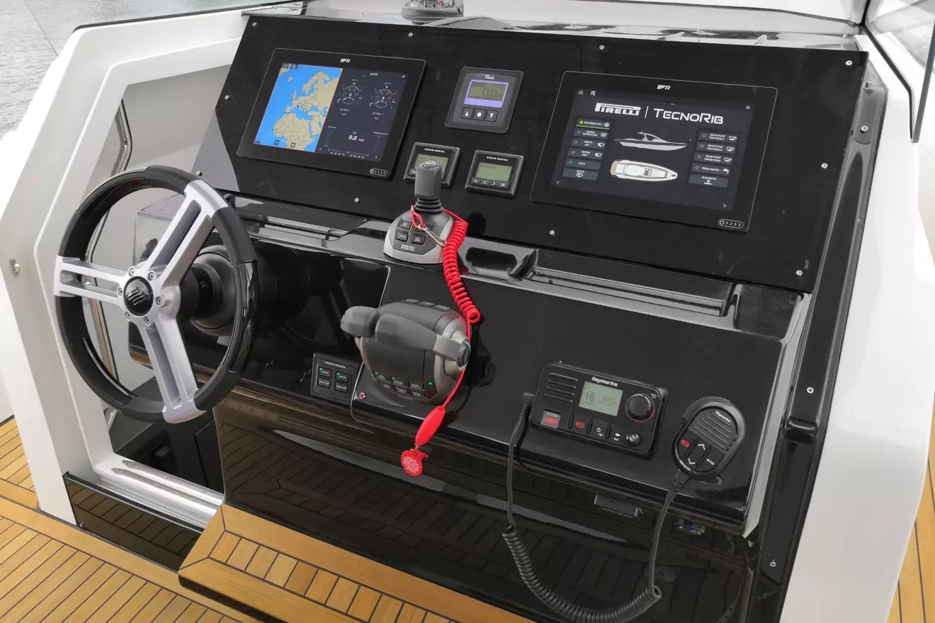 Ergonomic helm station of the Pirelli 42 with modern navigation instruments and skipper steering wheel