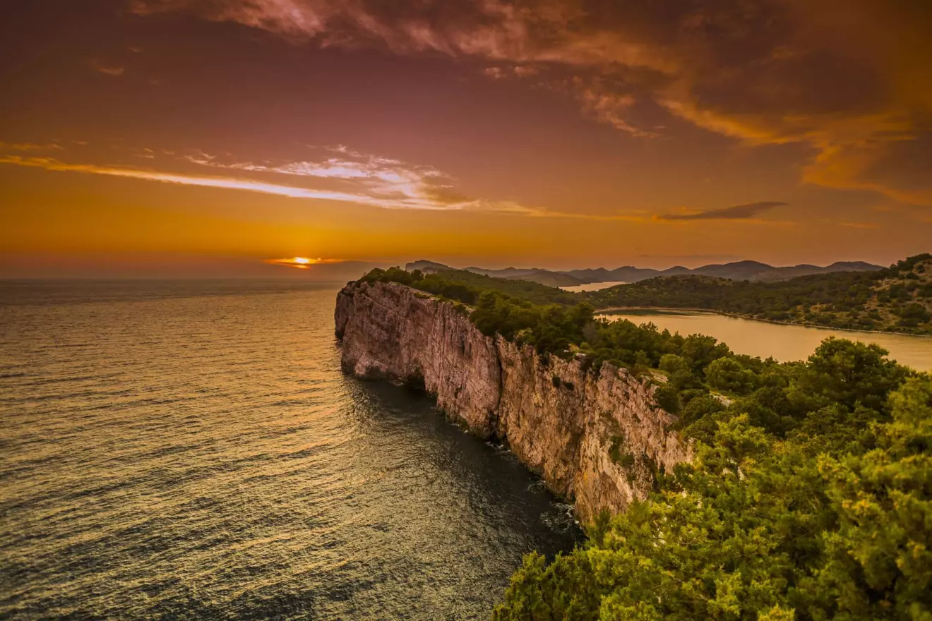 Steep cliffs of Telašćica Nature Park rising above the Adriatic, popular stop on a yacht cruise Croatia itinerary
