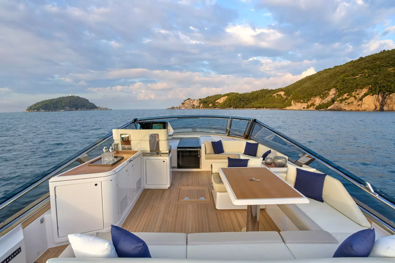 Itama 54 cockpit with large U-shaped aft sofa and intimate forward seating area