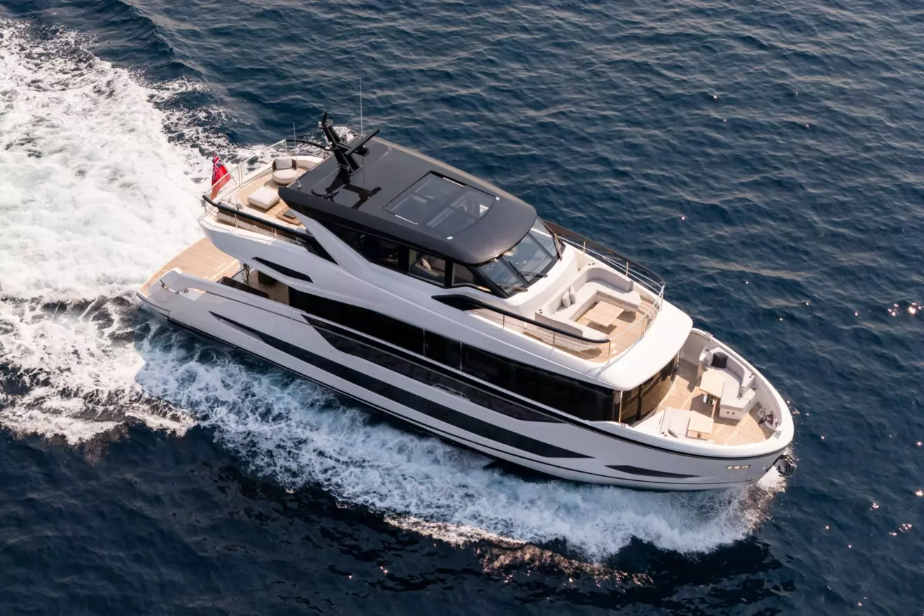 Aerial view of Sunseeker Ocean 82 Enclosed pocket superyacht running at speed, highlighting the full length of the deck layout
