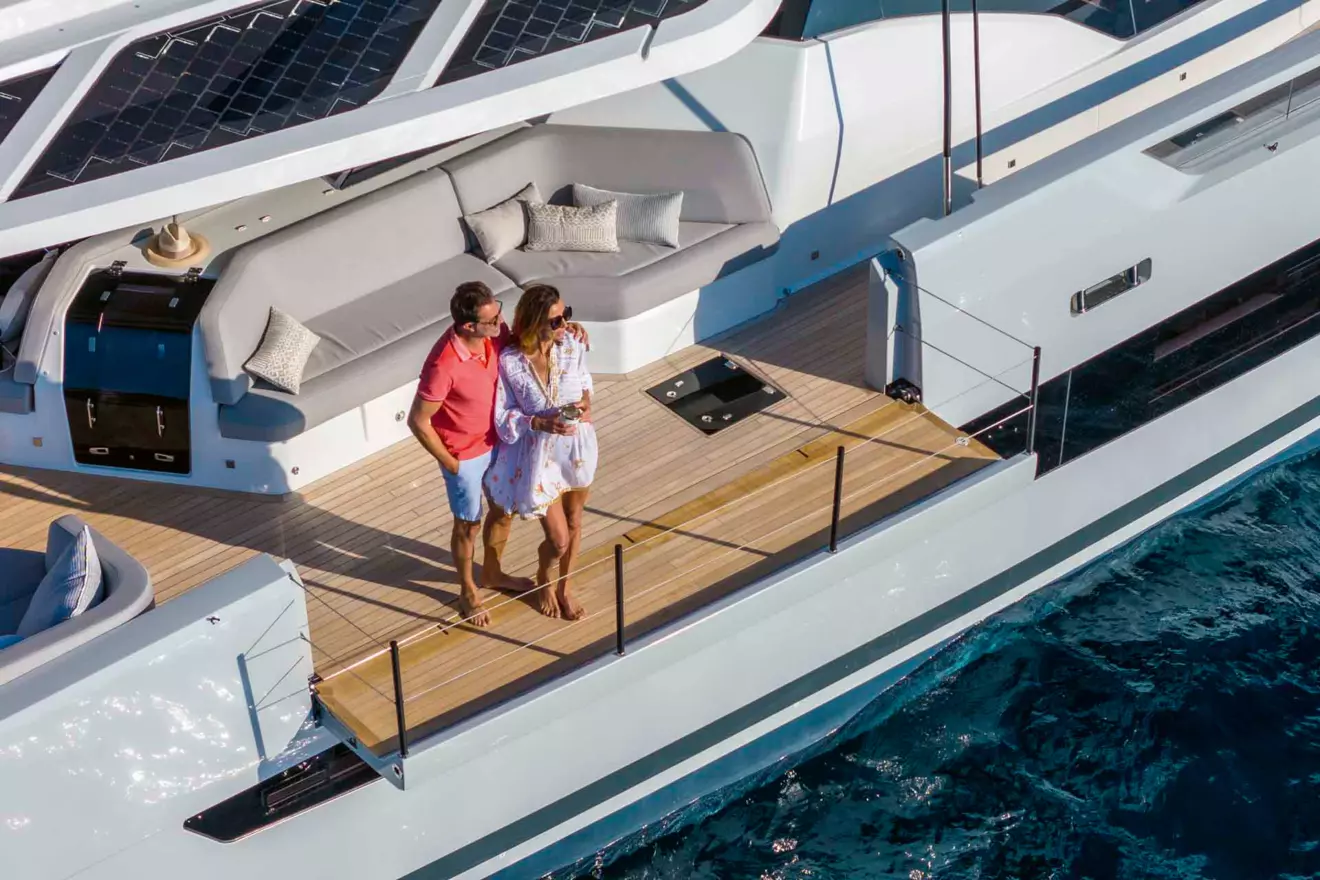 The Fountaine Pajot Thira 80 features innovative side deck lounges with retractable balconies, extending the living space outdoors. 