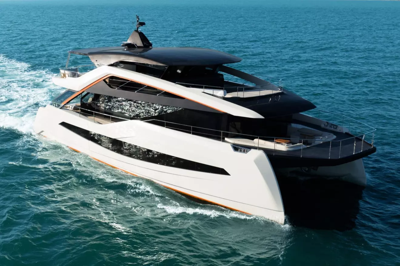 Radically designed catamaran WiderCat 92 with sleek lines cruising on open water.