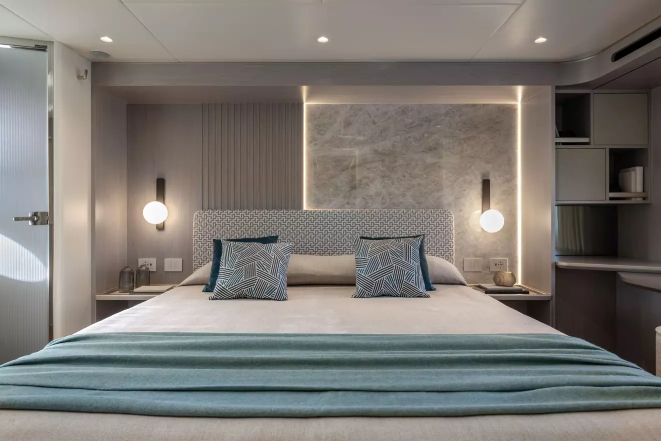 Full-beam VIP cabin of the Absolute 70 Fly featuring elegant furnishings and private head.