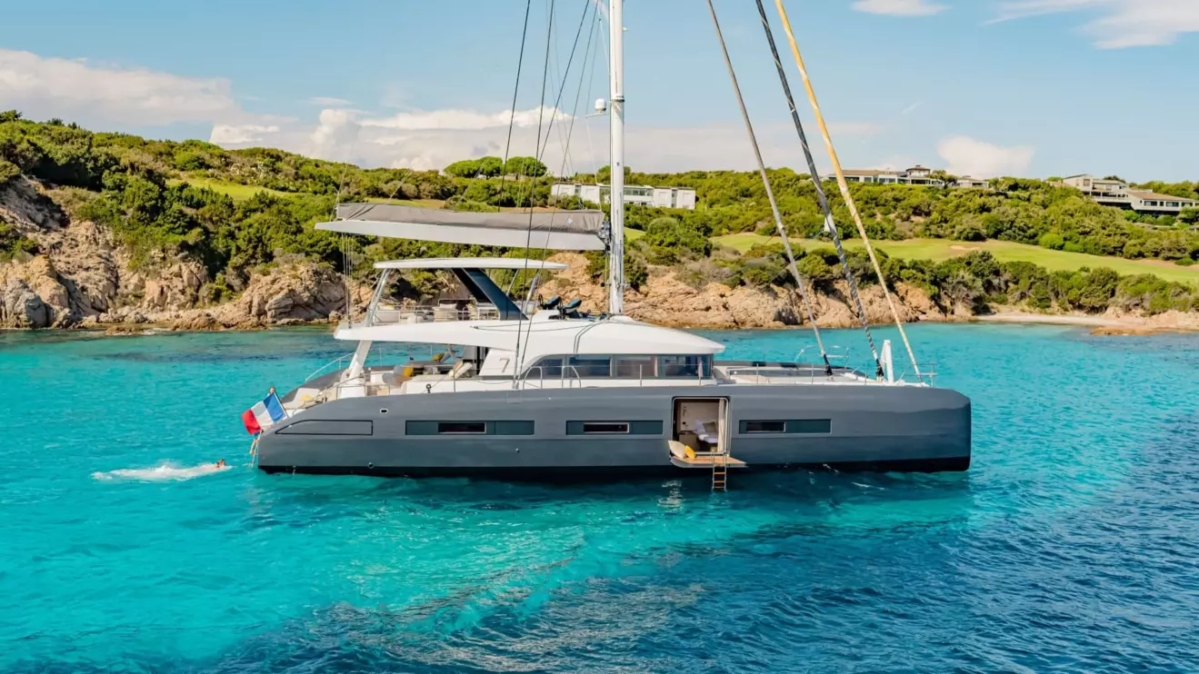 A luxurious Lagoon Seventy 7 catamaran, side view highlighting its sleek profile and elegant design.