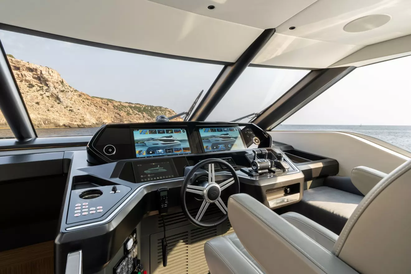 Enclosed flybridge helm station on Sunseeker Ocean 82 featuring Garmin navigation displays
