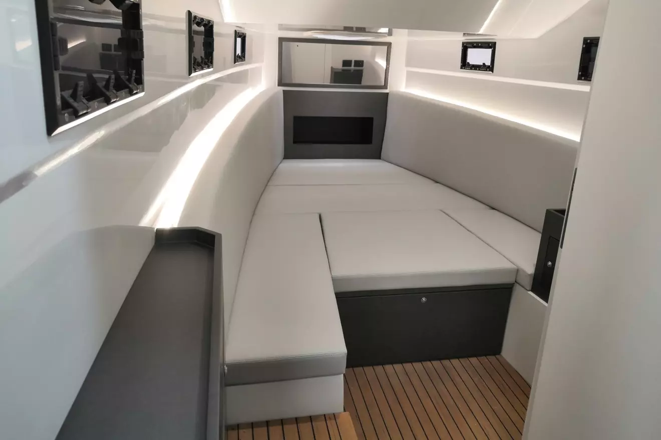 Minimalist and spacious cabin interior below deck on the Pirelli 42 maxi RIB