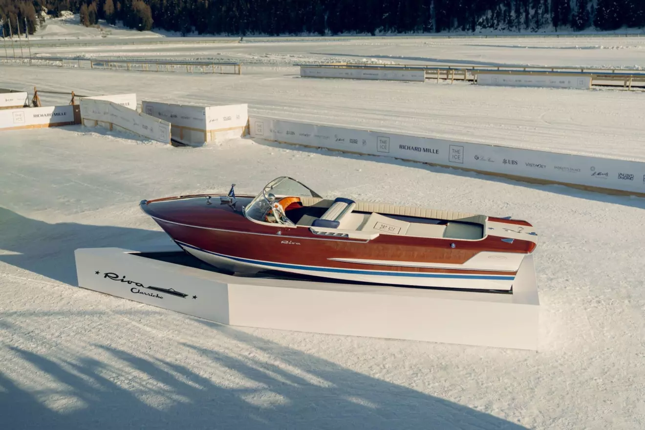 Close-up of a gleaming Riva Olympic boat, highlighting its polished wood and classic lines, exhibited by Riva Classiche at The I.C.E. St. Moritz.