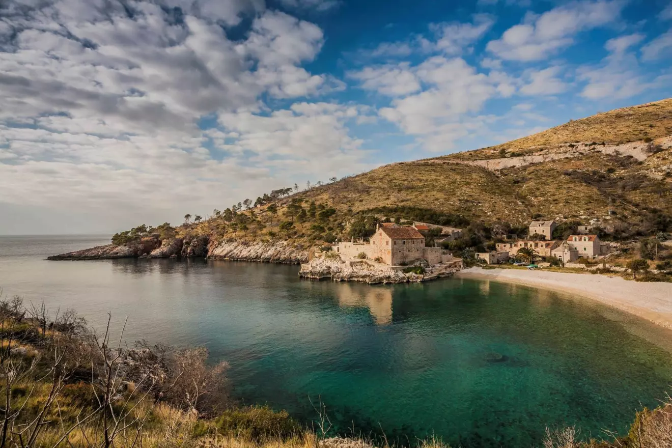 Croatia's Secluded Beaches: Crystal-clear waters and an old stone house at Dubovica Beach