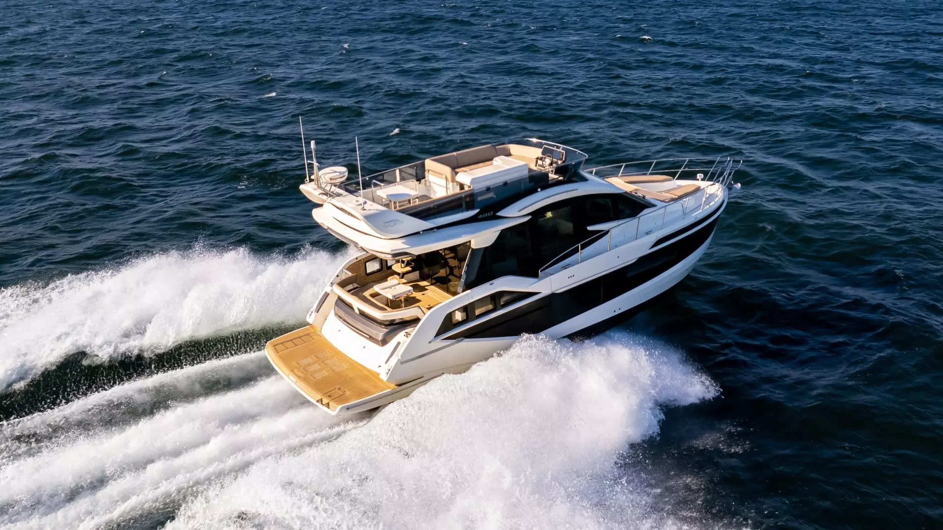 Galeon 480 Fly exterior view featuring Tony Castro's signature wave-shaped superstructure glazing