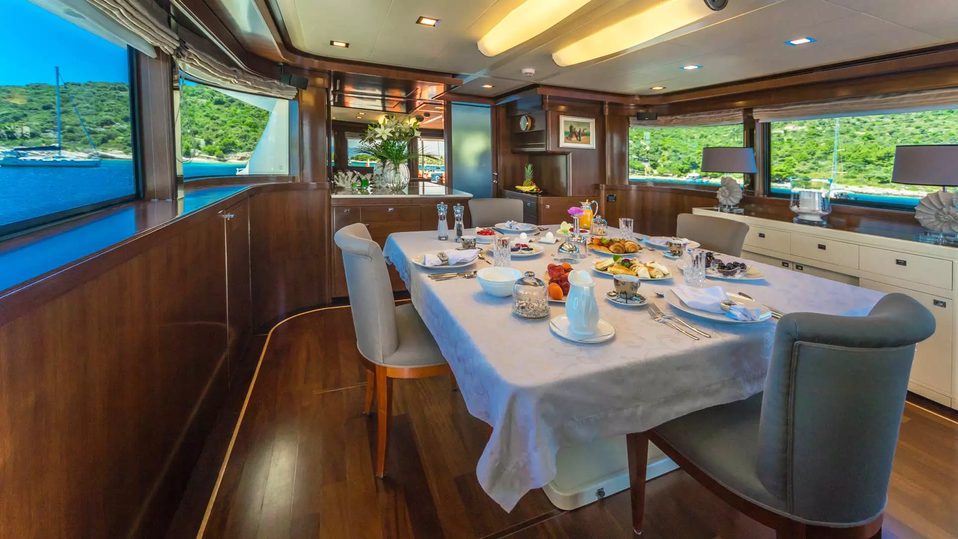 Upper deck dining table aboard yacht
