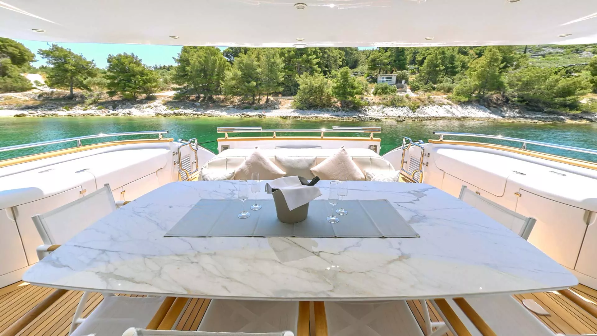 Aft dining table aboard luxury yacht