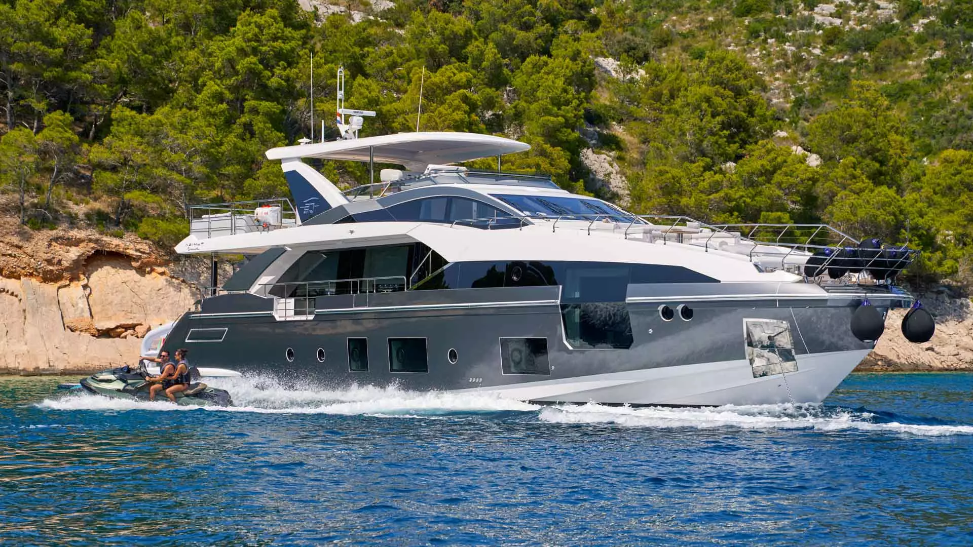 Jetski next to yacht