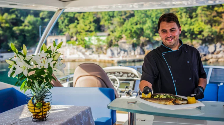 Yacht chef serving food
