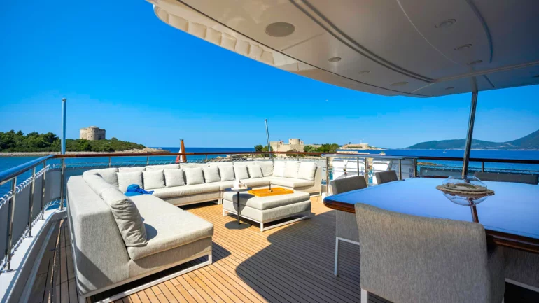 Flybridge and dining area of a spacious yacht