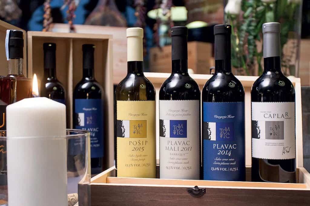 This is photo of pošip and plavac wines from Winery Tomic