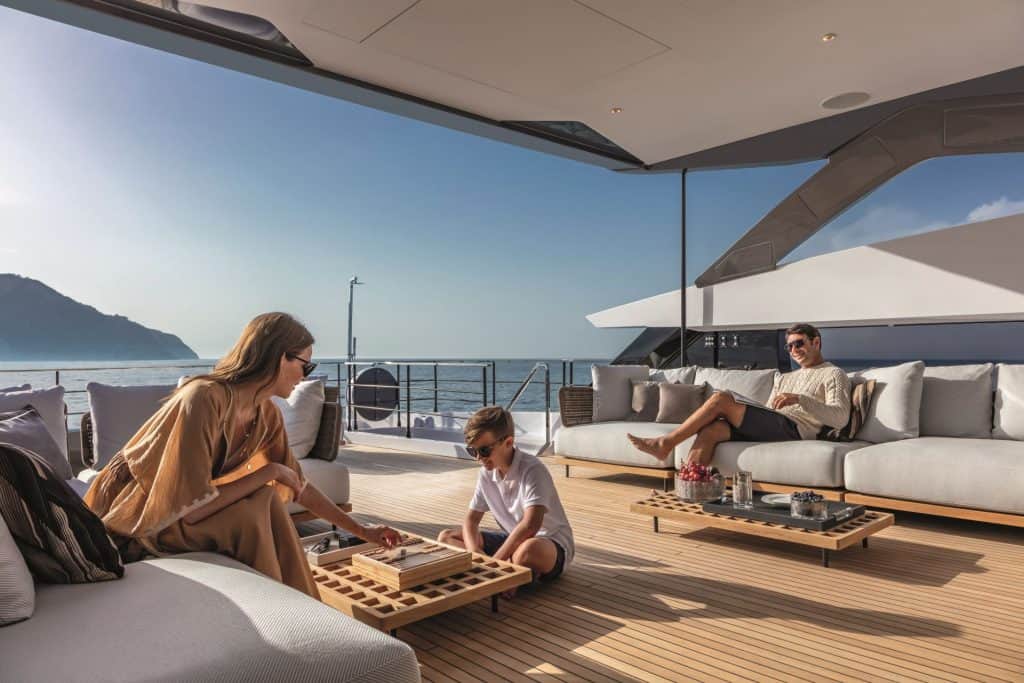 Happy couple with kid on a yacht