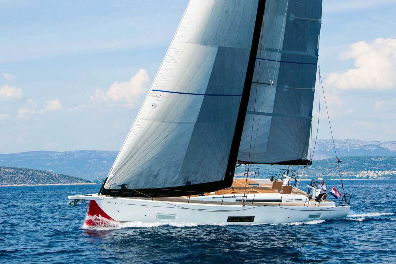 This is photo of a sailing boat First 53 sailing, side view