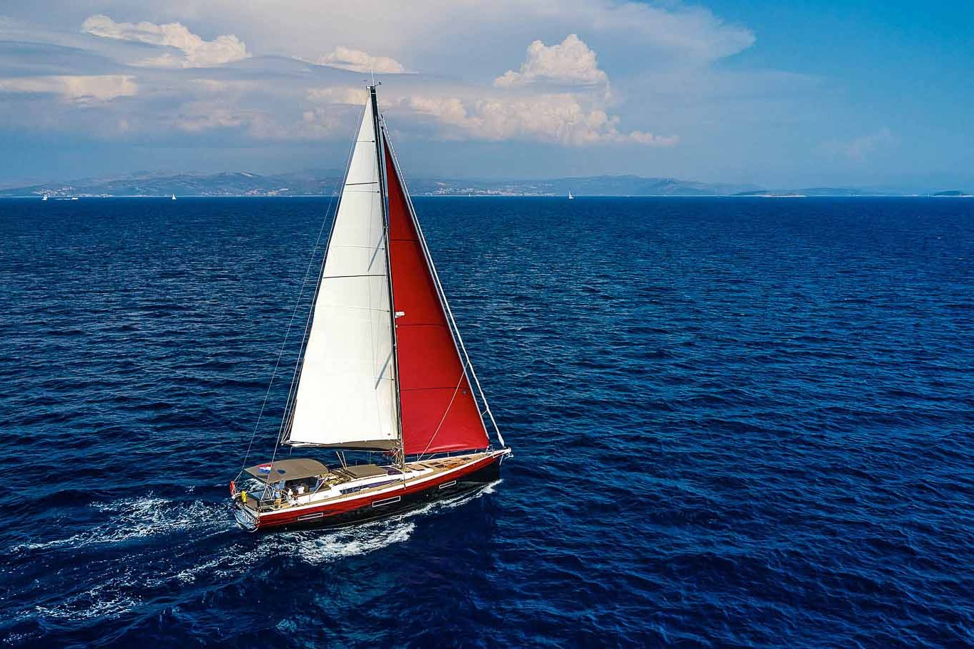 This is photo of a sailing boat Dufour 56 sailing side view