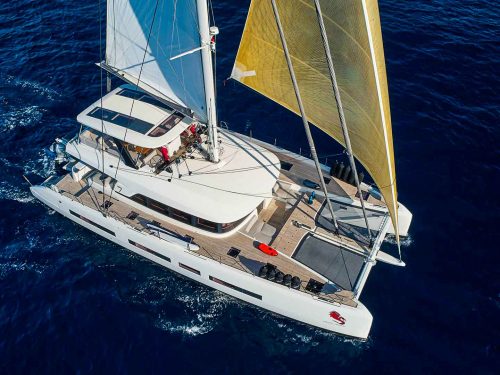 This is photo of a catamaran Lagoon 77 named Adriatic Dragon, sailing aerial view