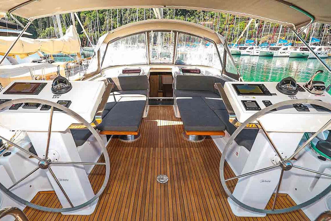 This is photo of a sailing boat Hanse 548 cockpit and wheel view