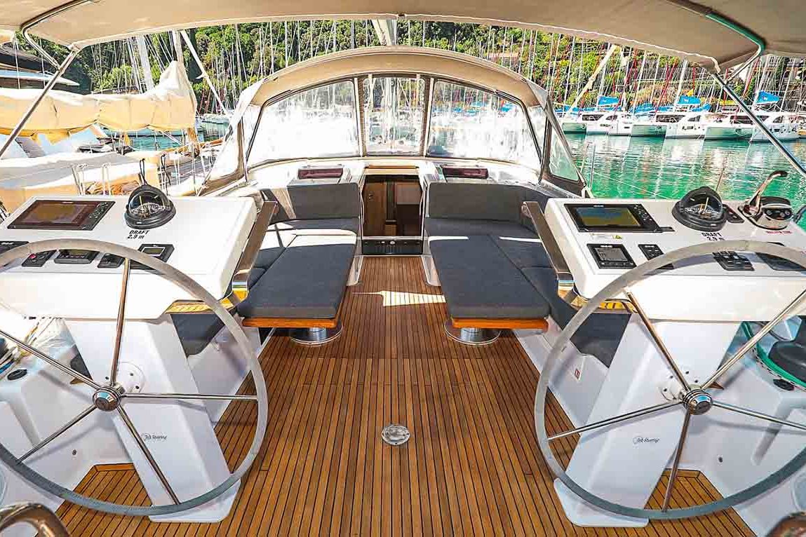 This is photo of a sailing boat Hanse 548 cockpit and wheel view