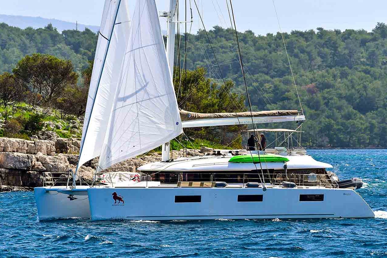 This is photo of a catamaran Lagoon 620 sailing toward bay, Croatia