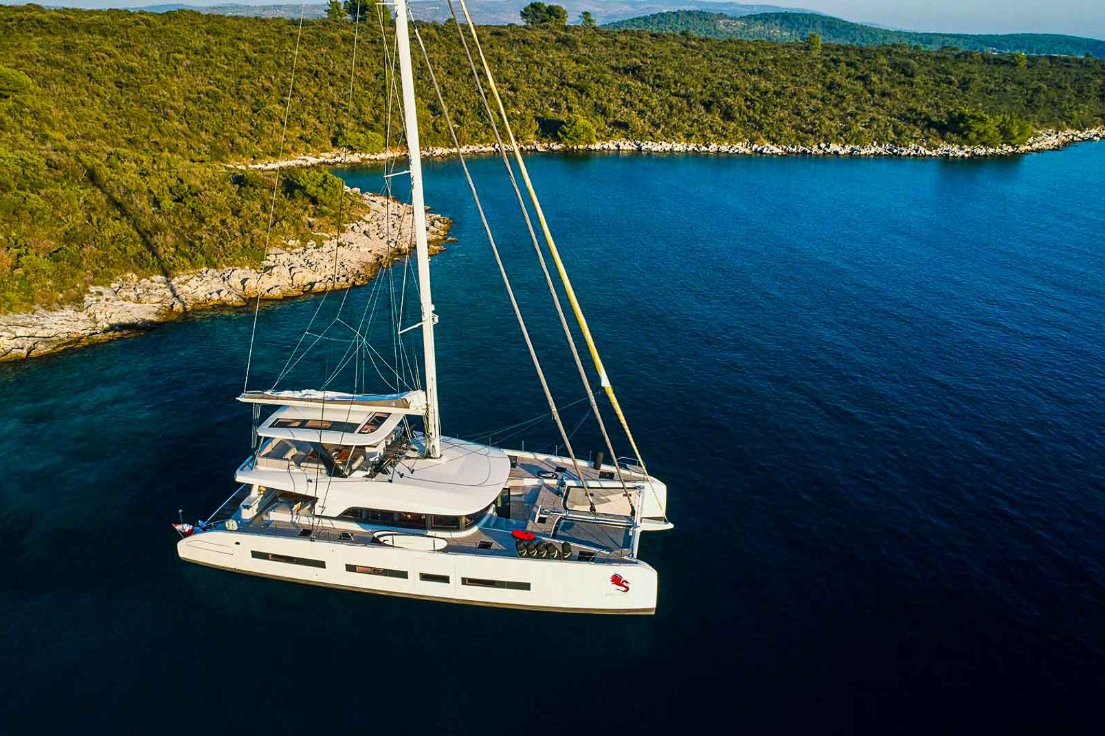 This is photo of a catamaran Lagoon 77 named Adriatic Dragon aerial view, anchor