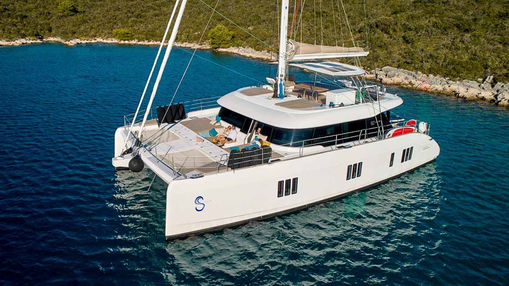 This is photo of a catamaran Sunreef 60 at anchor