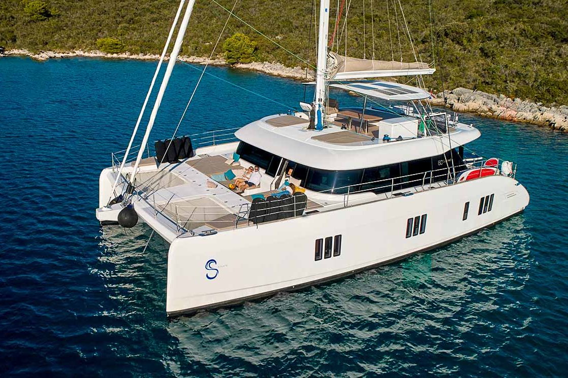 This is photo of a catamaran Sunreef 60 at anchor