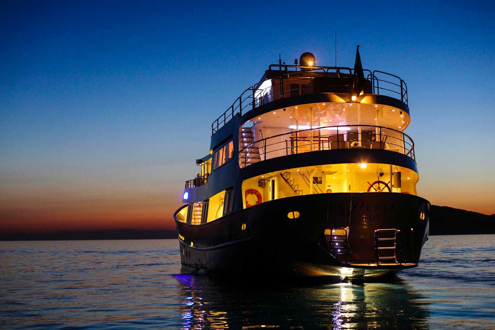 Luxury boutique yacht La Perla night view