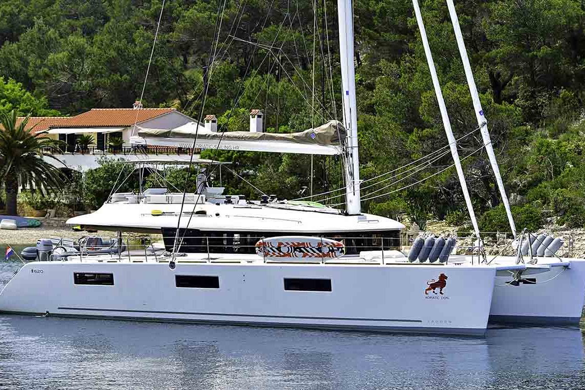 This is photo of a catamaran Lagoon 620 at anchor