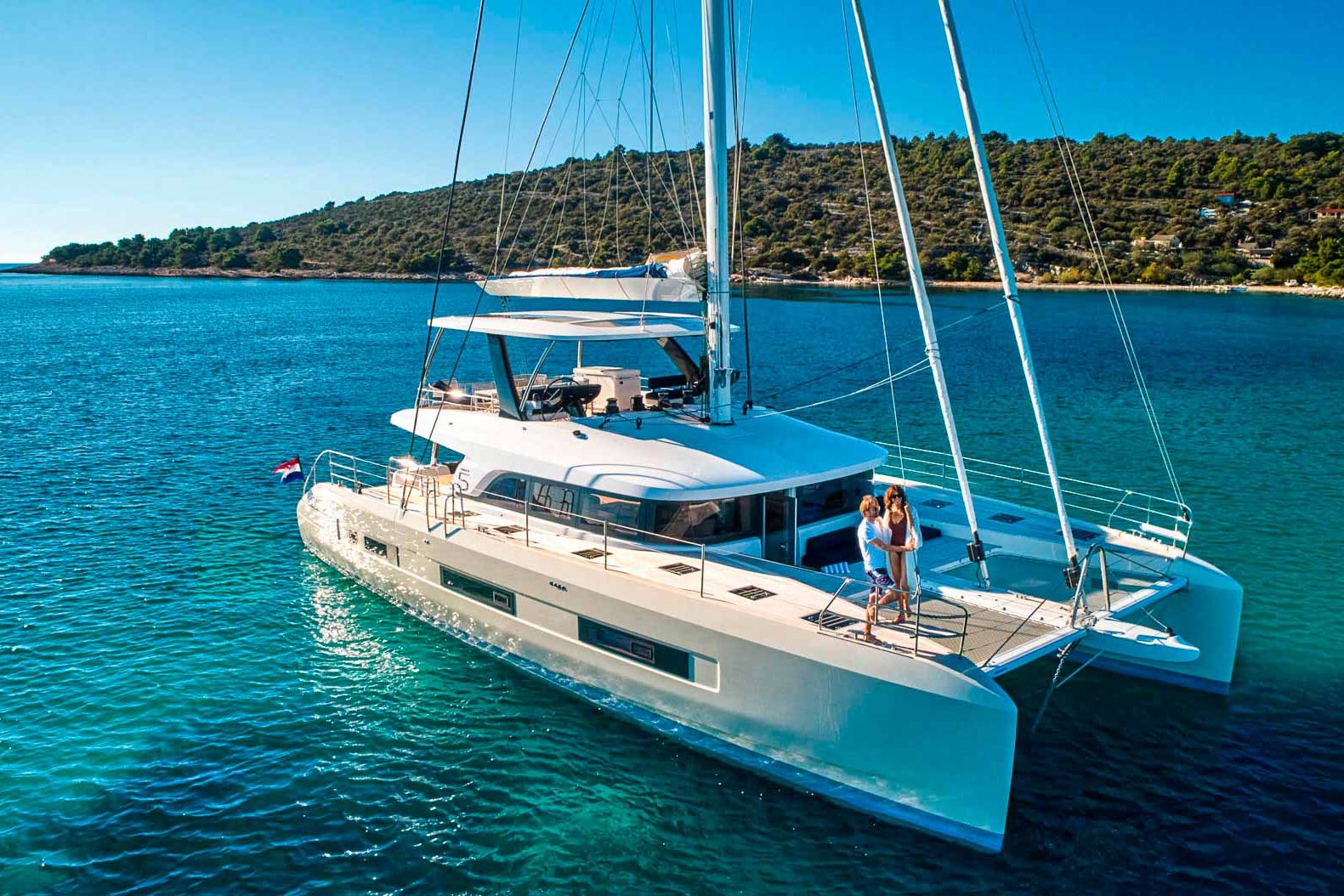 This is photo of a catamaran Lagoon Sixty5 named Amada Mia port side view