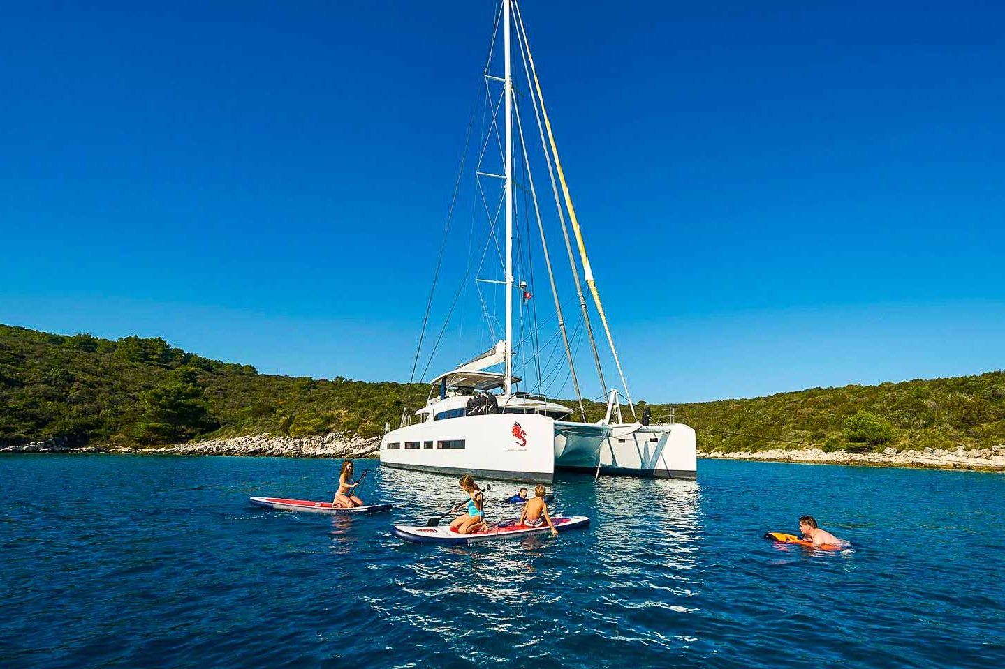 This is photo of a catamaran Lagoon 77 named Adriatic Dragon on sea, water toys