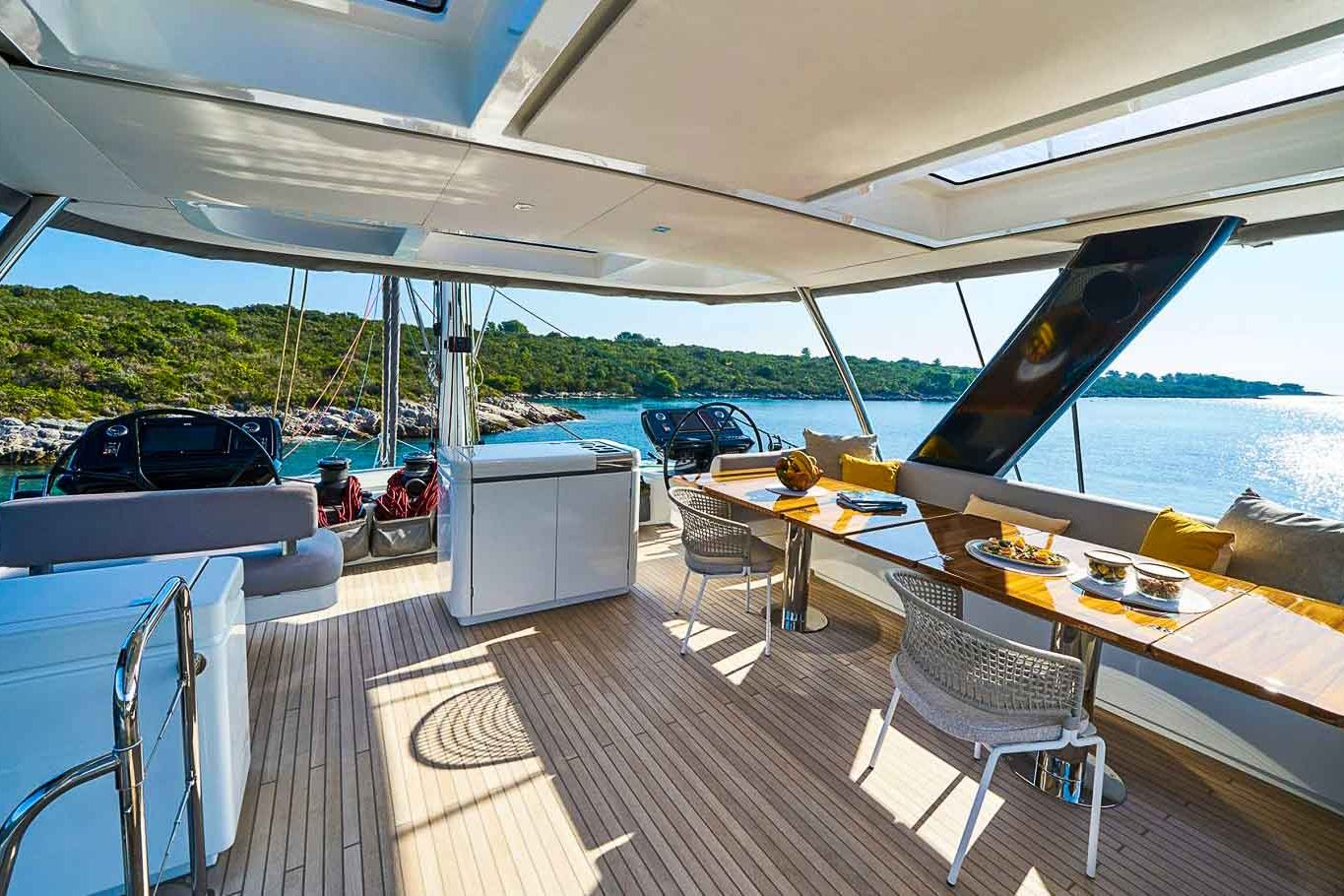 This is photo of a catamaran Lagoon 77 named Adriatic Dragon flybridge seating table