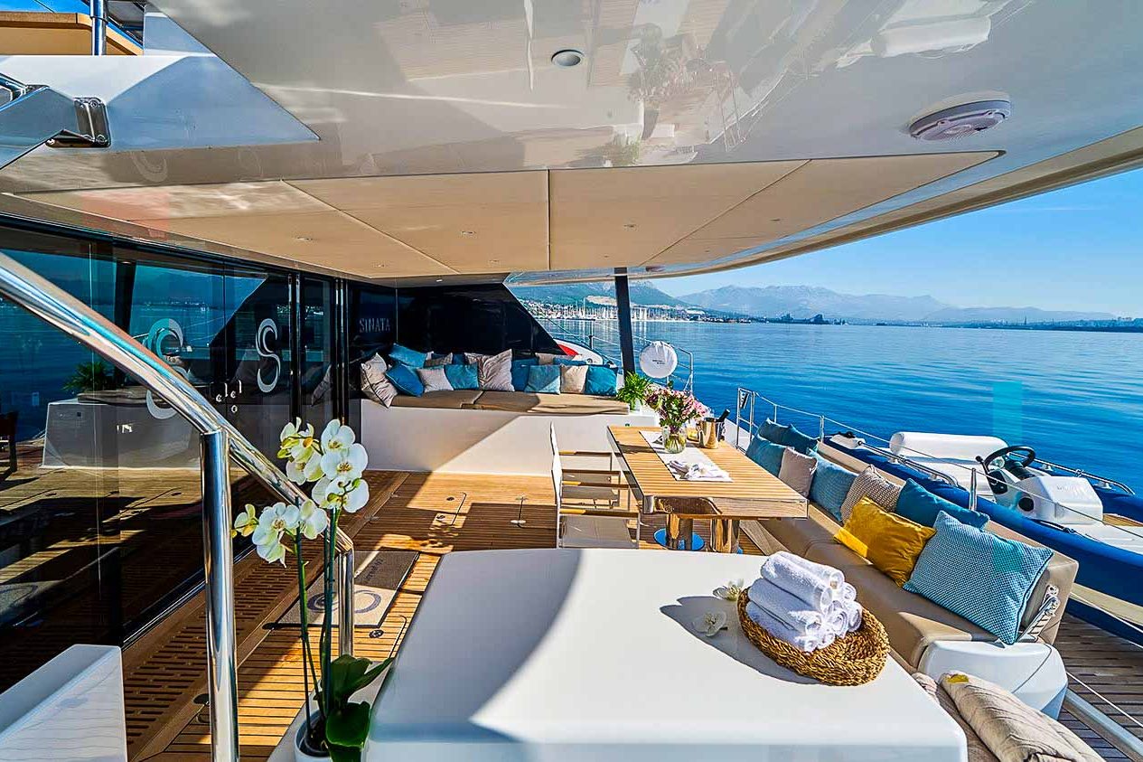 This is photo of a catamaran Sunreef 60 aft deck table