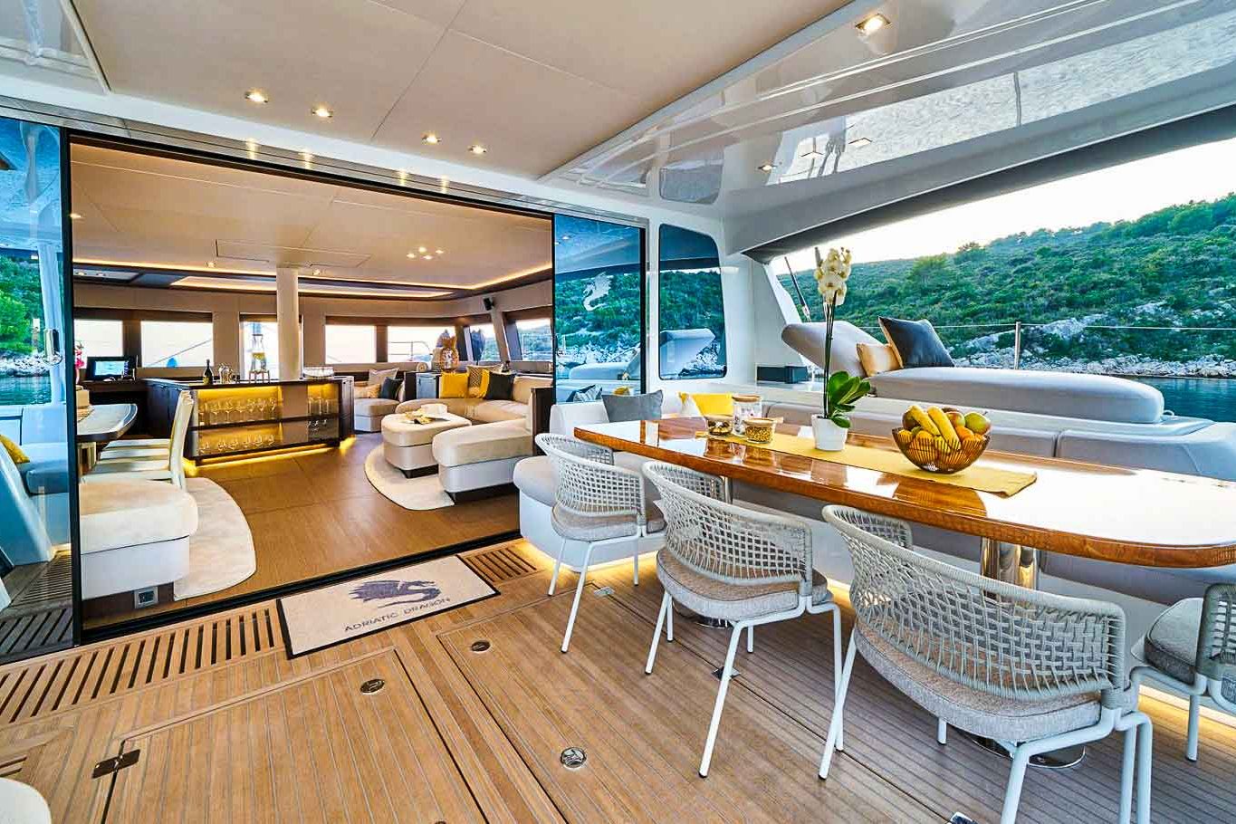 This is photo of a catamaran Lagoon 77 named Adriatic Dragon aft seating table