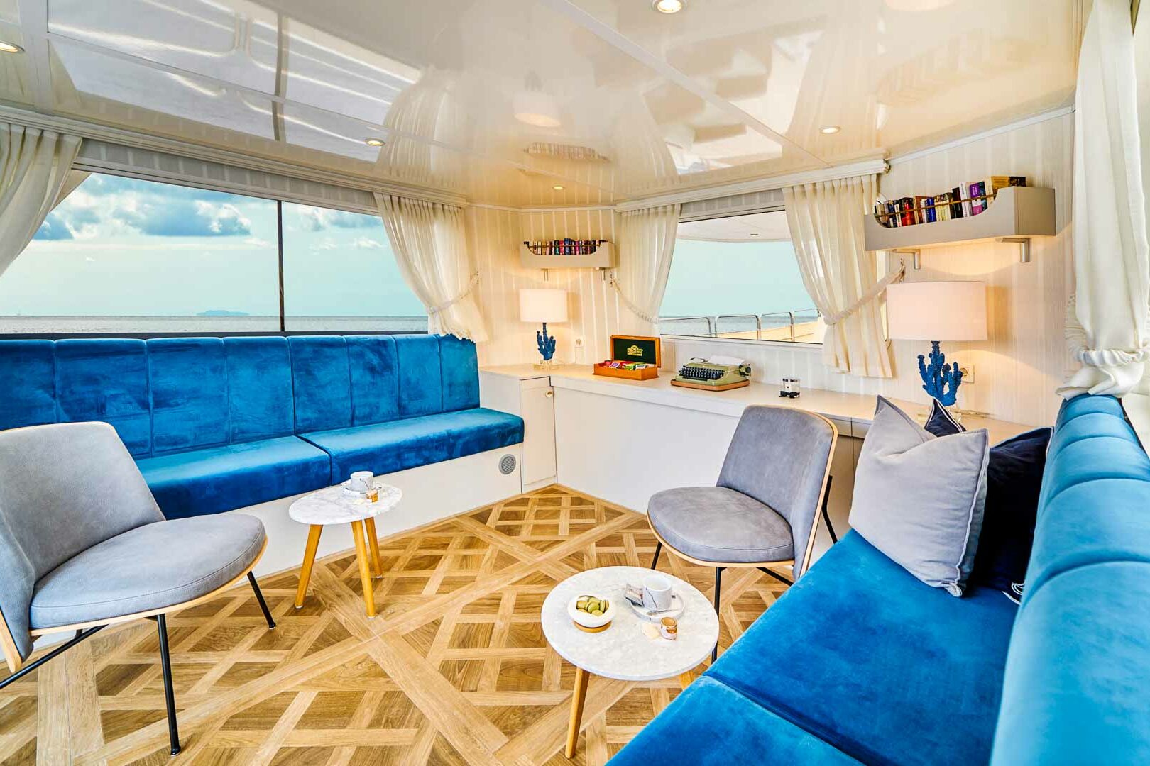 Luxury boutique yacht La Perla deck library view