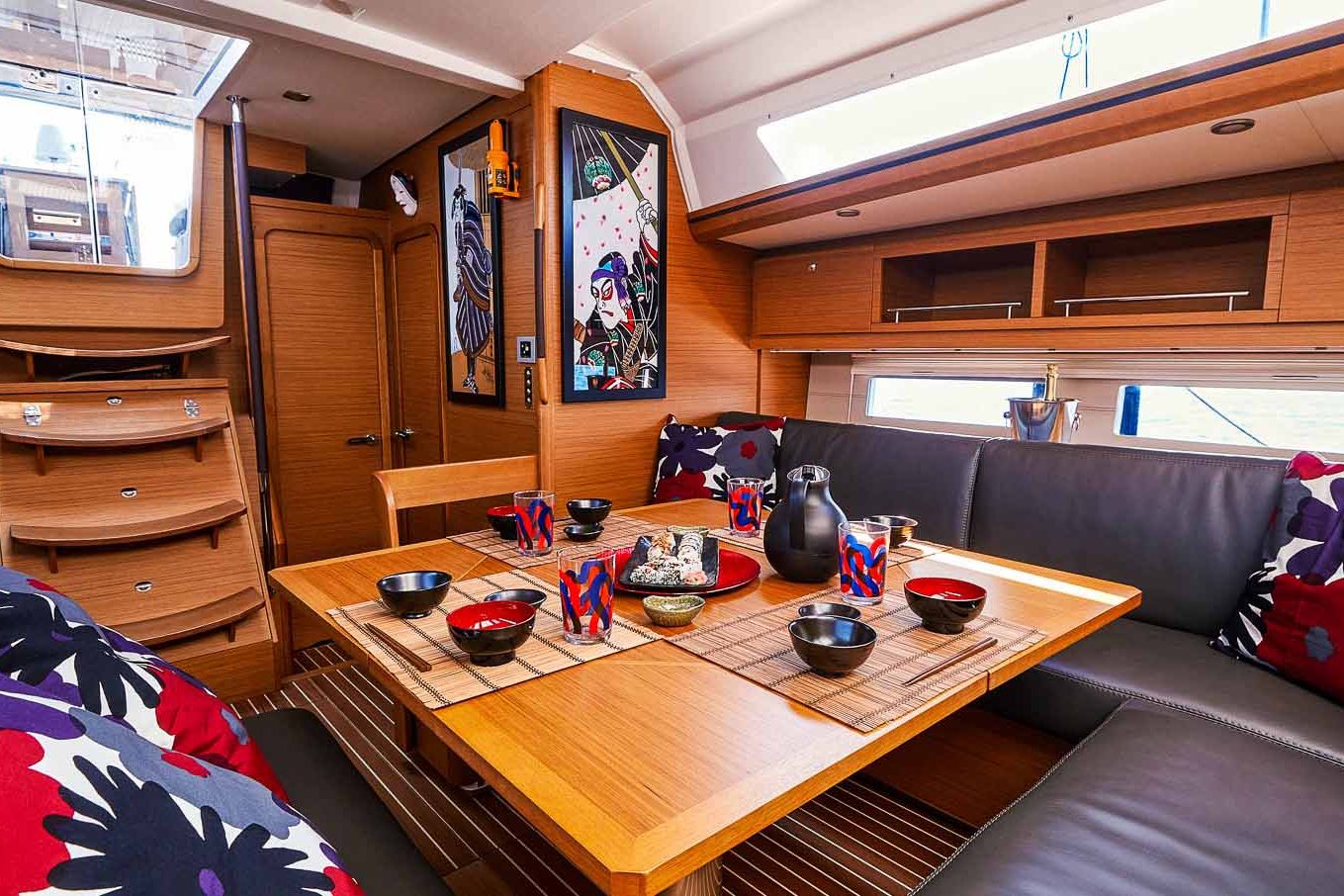 This is photo of a sailing boat Dufour 56 saloon table and sofa