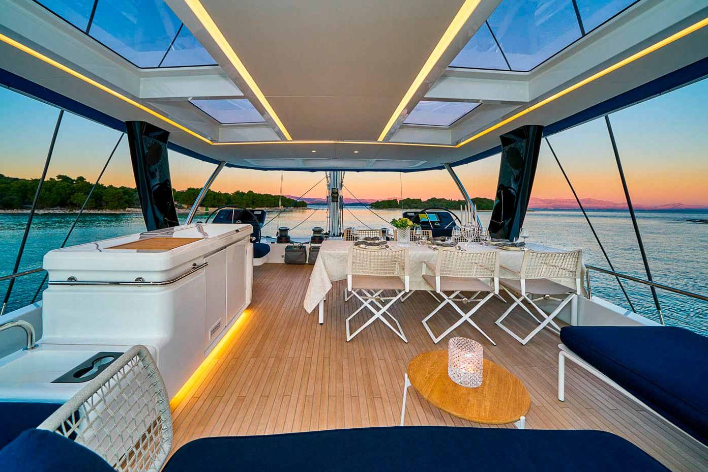 This is photo of a catamaran Lagoon Sixty5 named Amada Mia dining table on flybridge