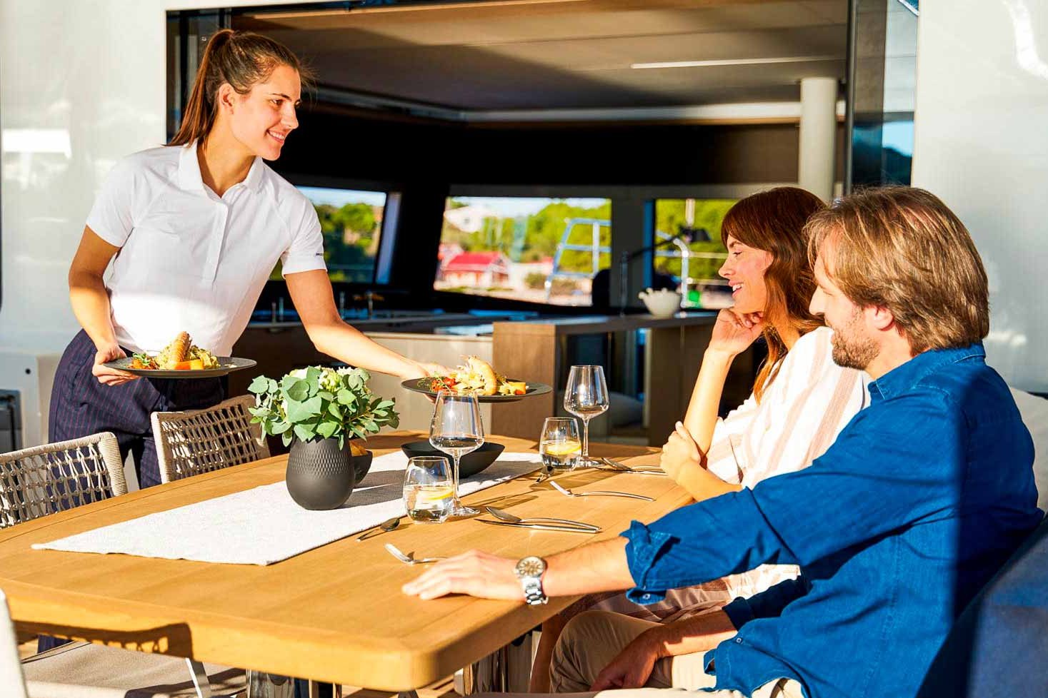 This is photo of a catamaran Lagoon Sixty5 named Amada Mia cockpit table