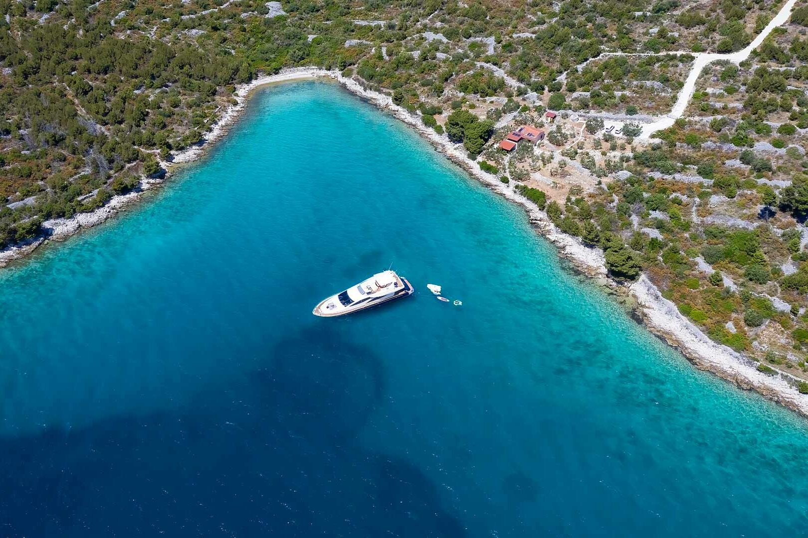 Luxury yacht Riva 85 ‘888’ anchored in the bay