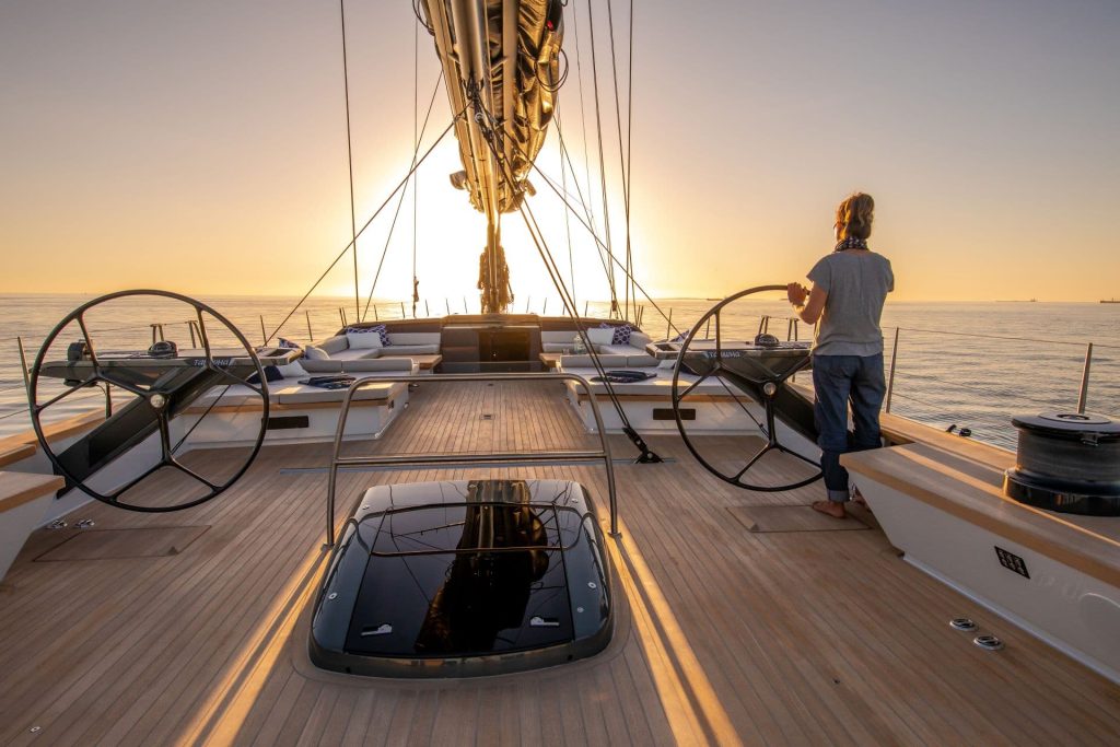 This is a photography of sailing superyacht sunset