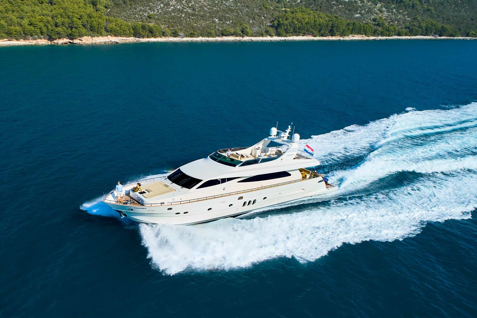 The luxury yacht Karisma running port side