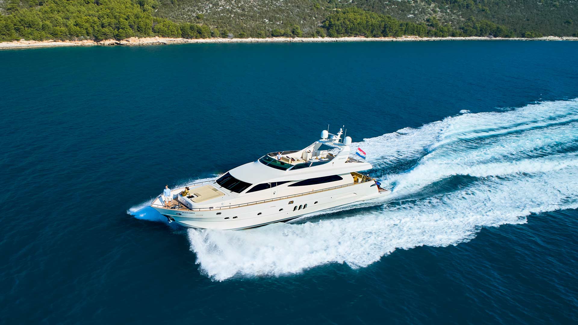 The luxury yacht Karisma running port side