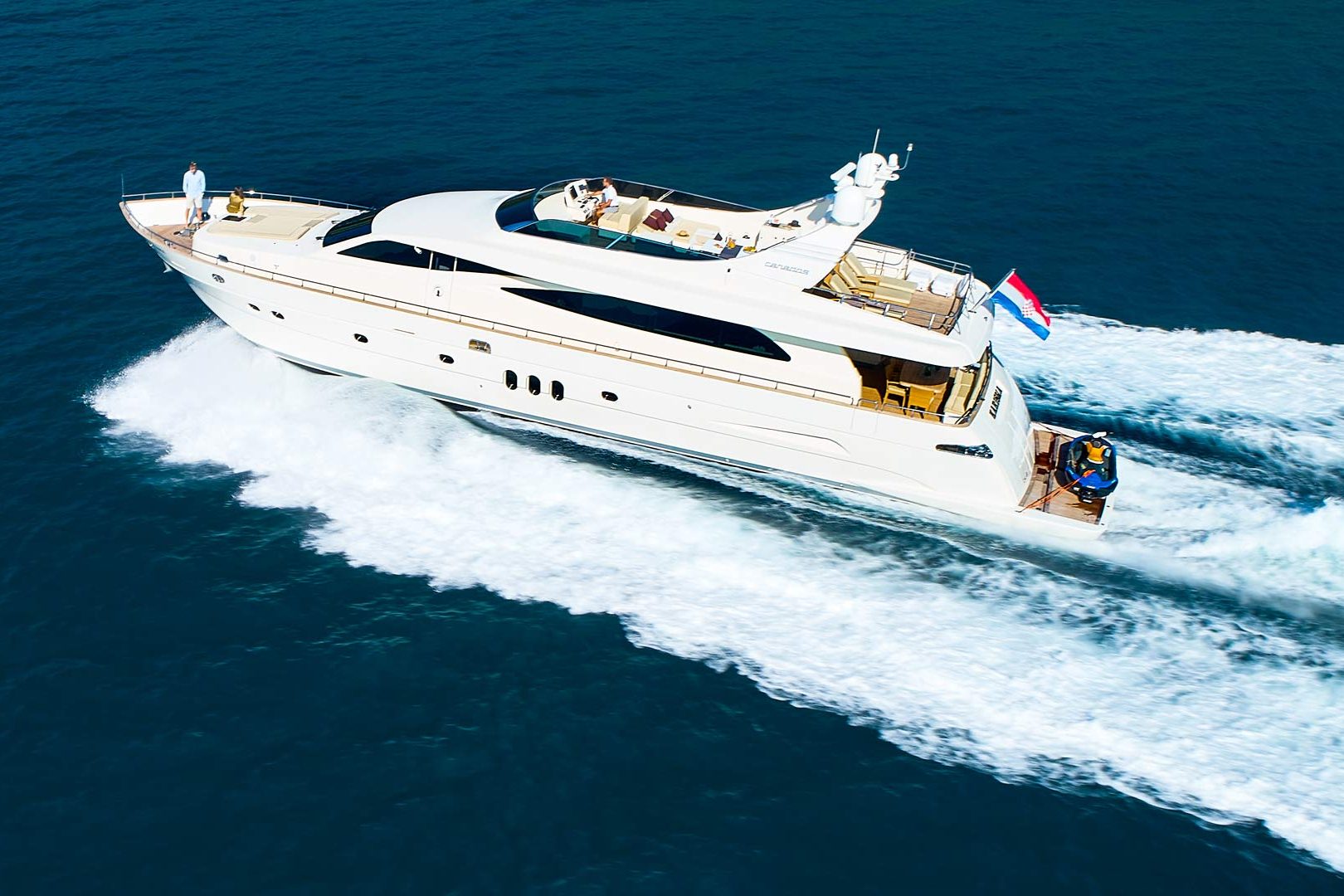 The luxury yacht Karisma running port stern view