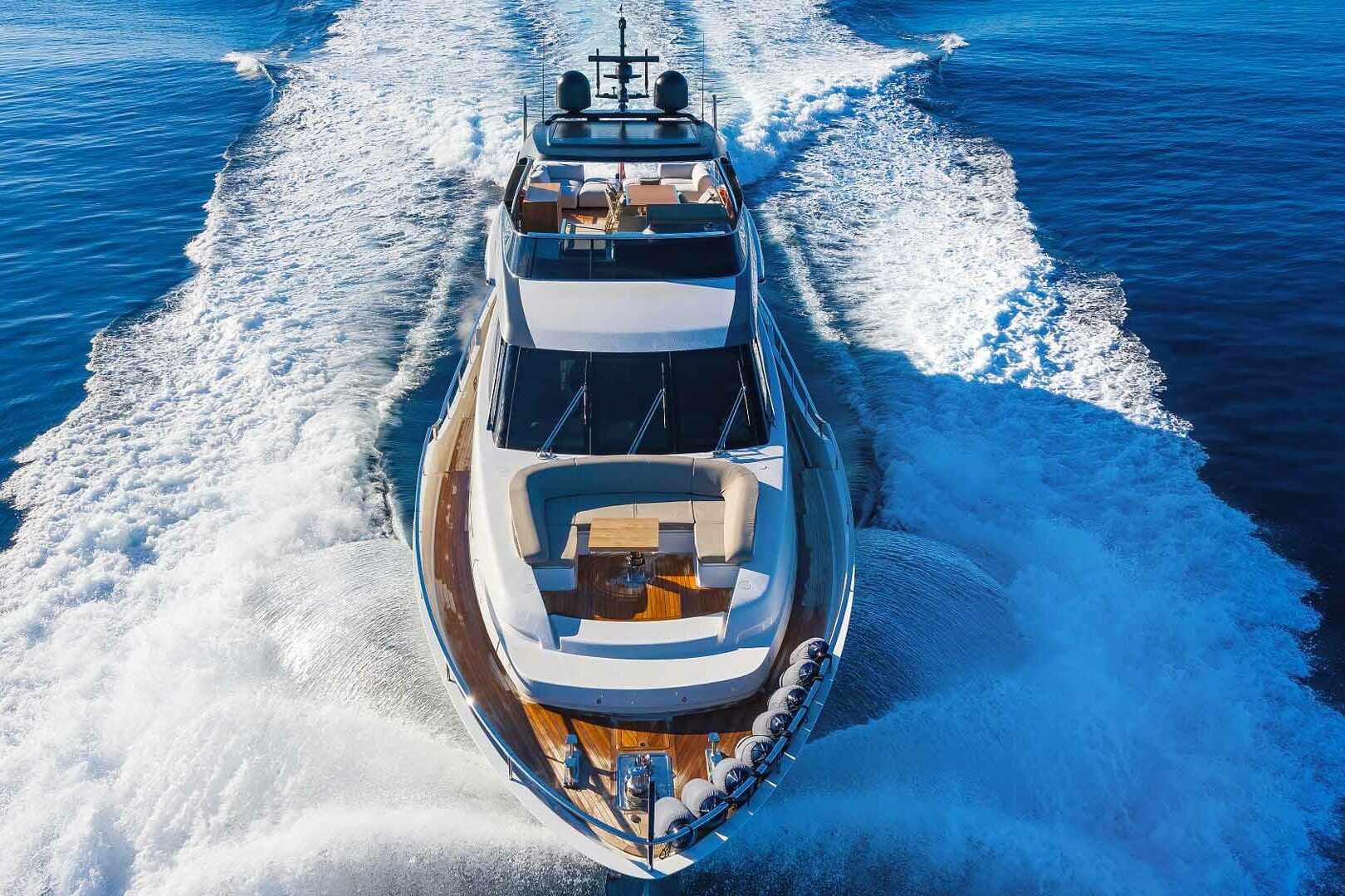 Luxury yacht Secundus running top view