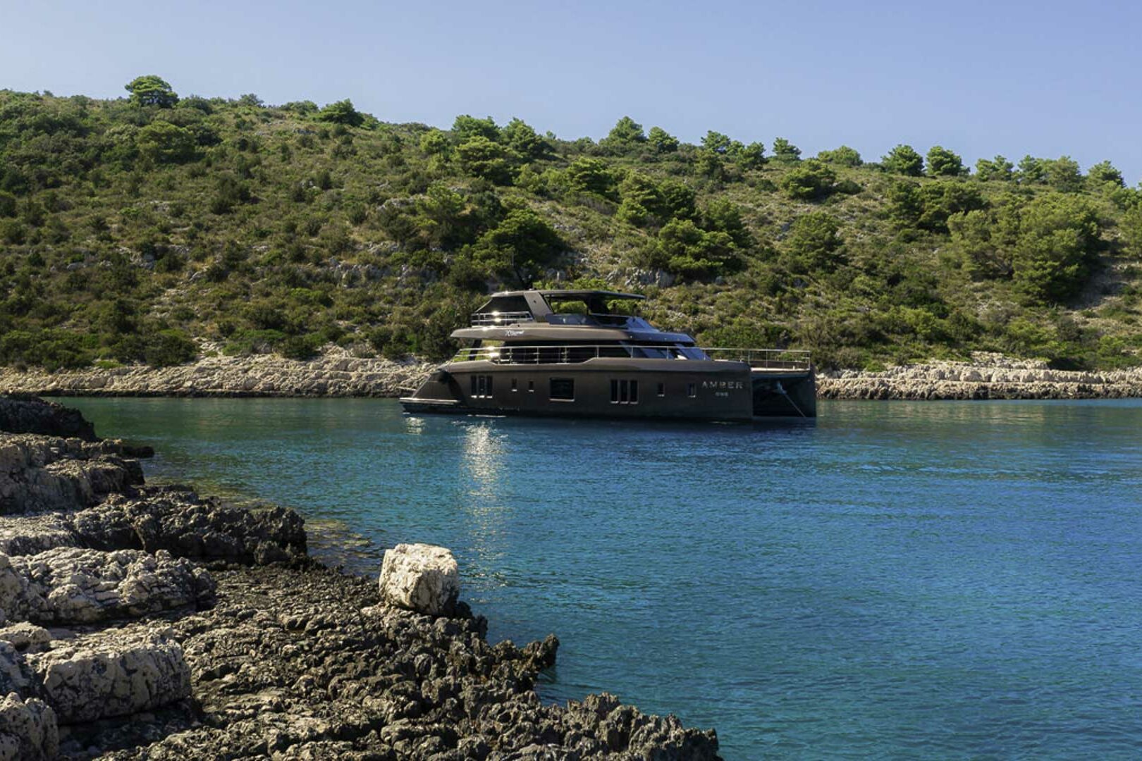 Luxury catamaran Sunreef 70 Power anchored in the bay